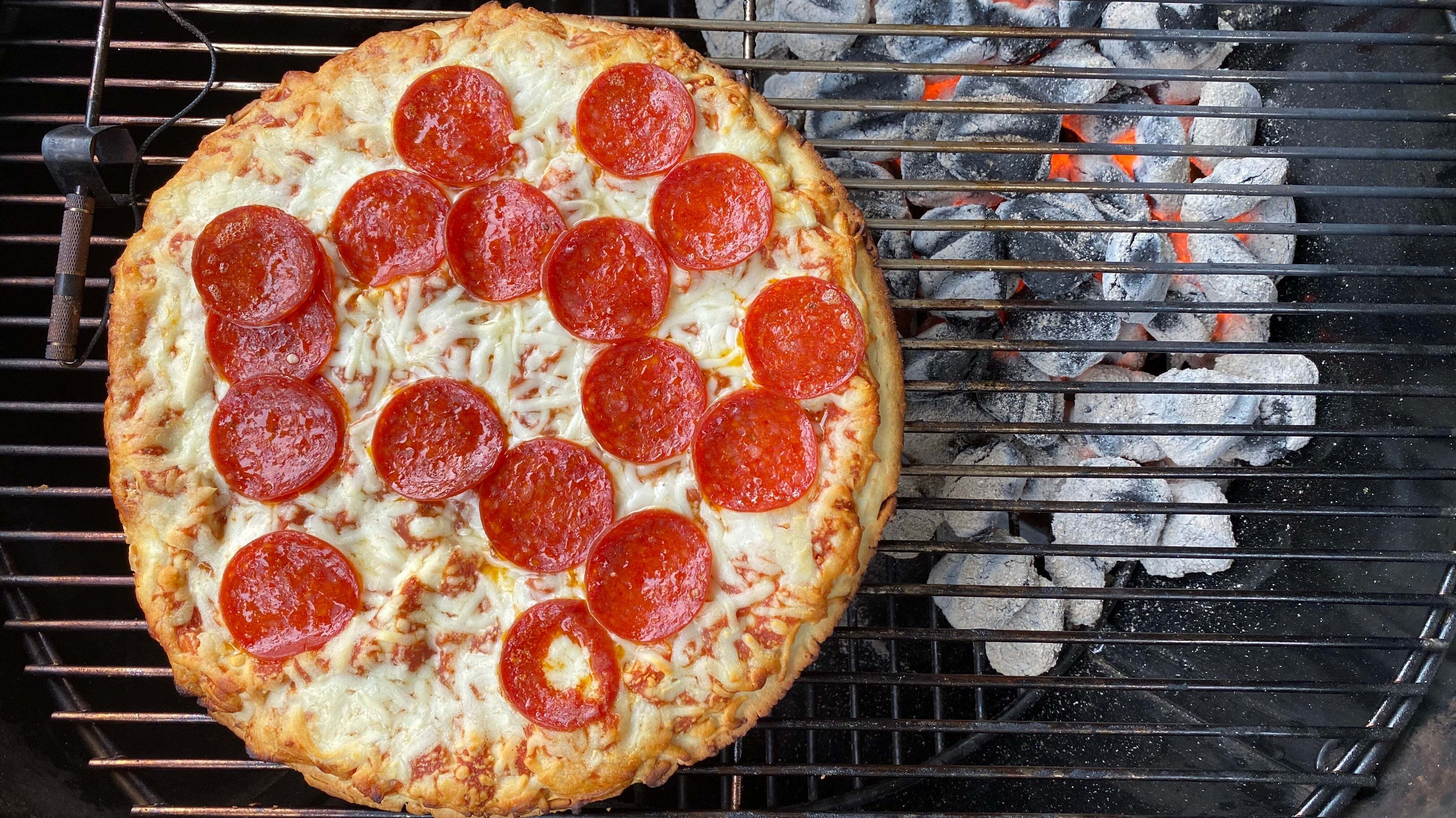 Grilling Frozen Pizza on Charcoal Grill